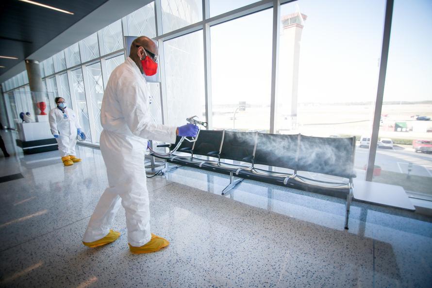 Custodial team member cleaning at IAH