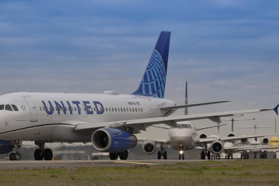 Airplanes lining up for departure at IAH